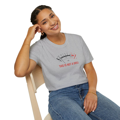 Smiling woman in casual grey t-shirt with 'This is not a drill' graphic VU meter design