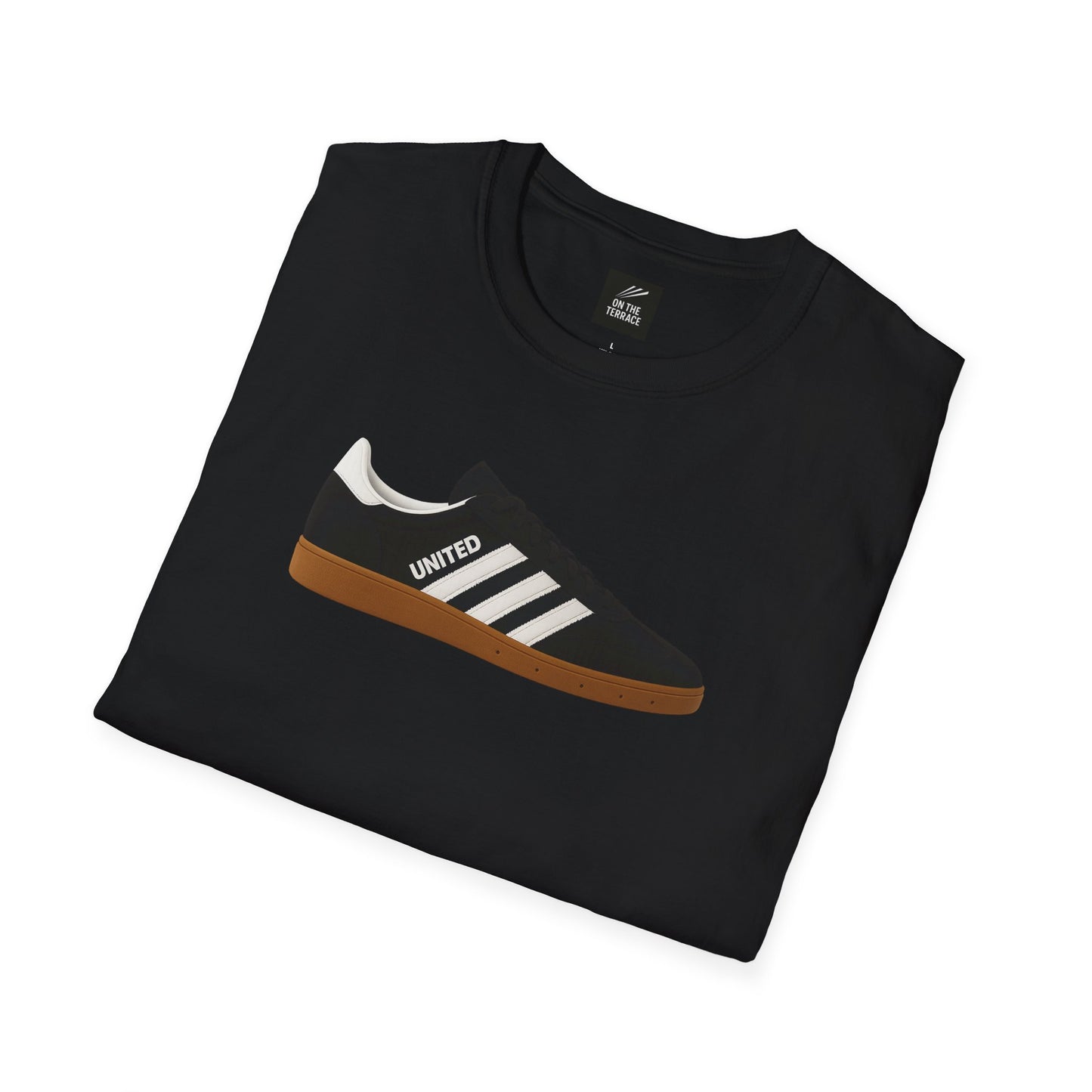 Black folded t-shirt with sneaker graphic featuring white stripes and 'UNITED' text on light brown sole