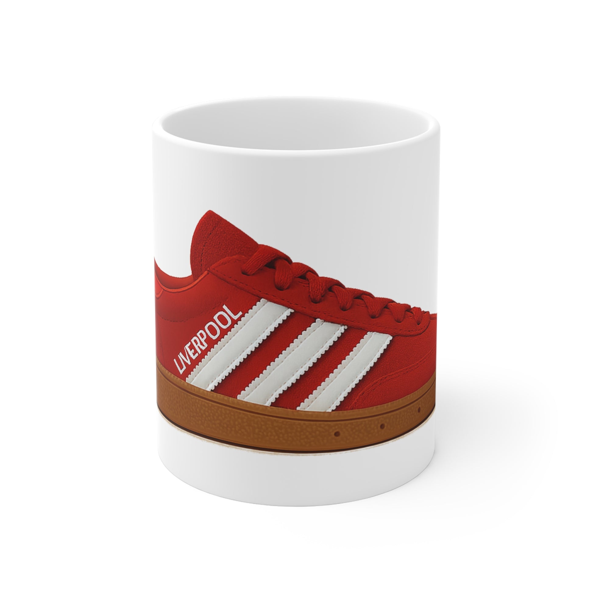 White mug with red Adidas-style Liverpool sneaker design featuring white stripes and brown sole