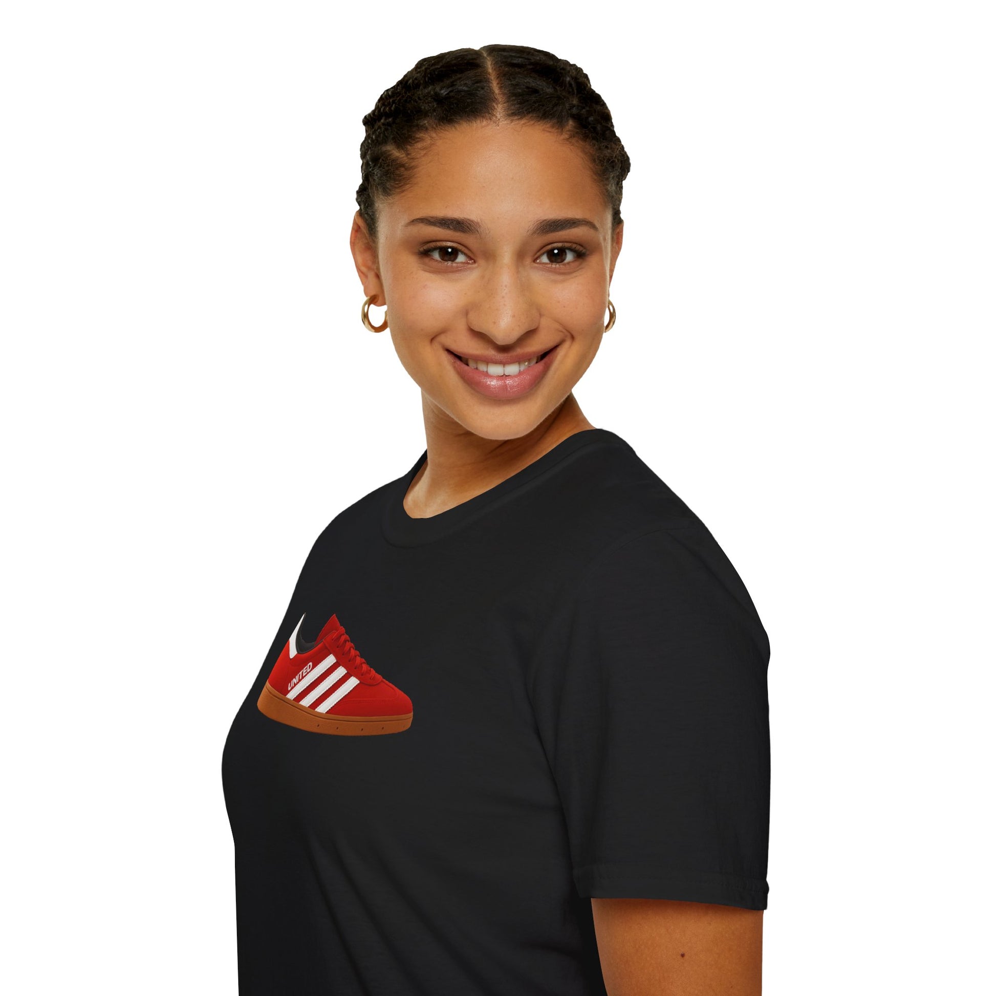 Smiling woman wearing black t-shirt with red sneaker graphic and gold hoop earrings