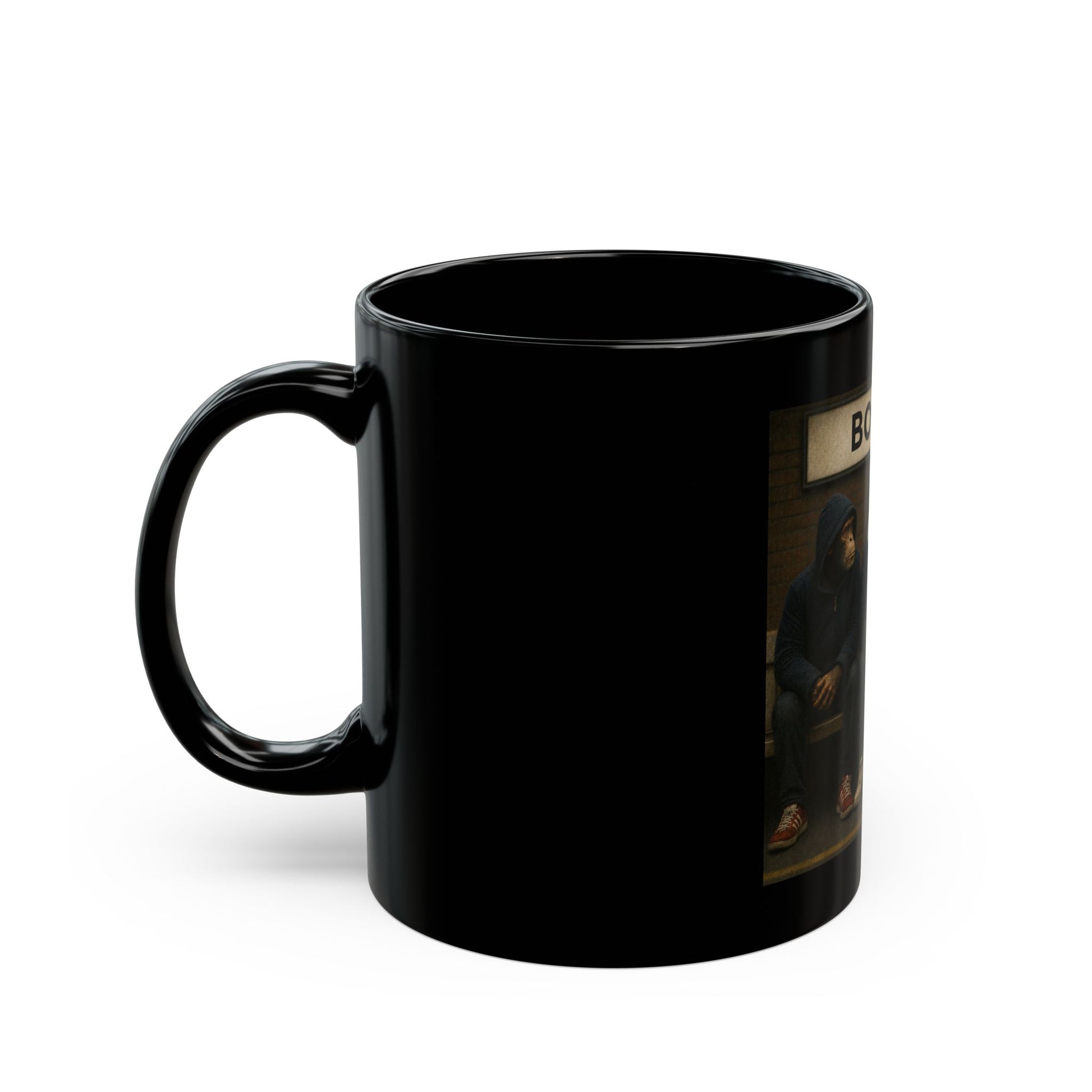 A high-gloss black ceramic mug features a rectangular graphic of three chimpanzees dressed as 1980s football casuals sitting on a railway platform bench. Above them hangs a vintage cream station sign with the word "BOLTON" in black capital letters. The monkeys wear casual coats, hoodies, retro low-profile trainers, and navy, white, and red striped bar scarves against a brick wall background.