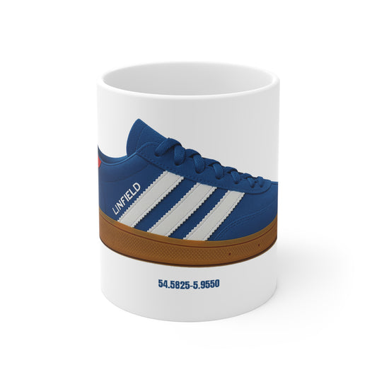 White mug featuring a blue Linfield sneaker with white stripes and coordinates printed below