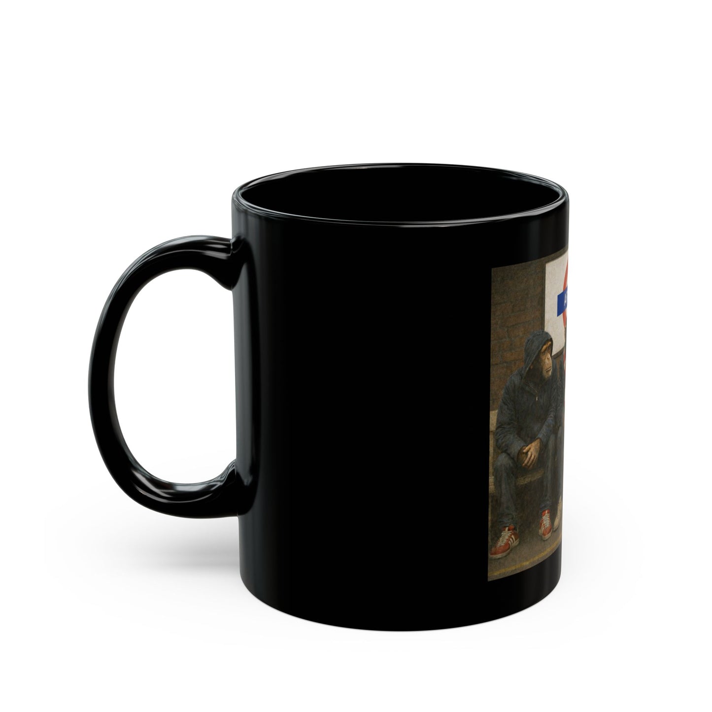A black ceramic coffee mug featuring a detailed graphic print from On The Terrace showing three chimpanzees dressed as football casuals in retro trainers and red-and-white striped scarves, sitting on a London Underground bench under an Arsenal tube station sign.