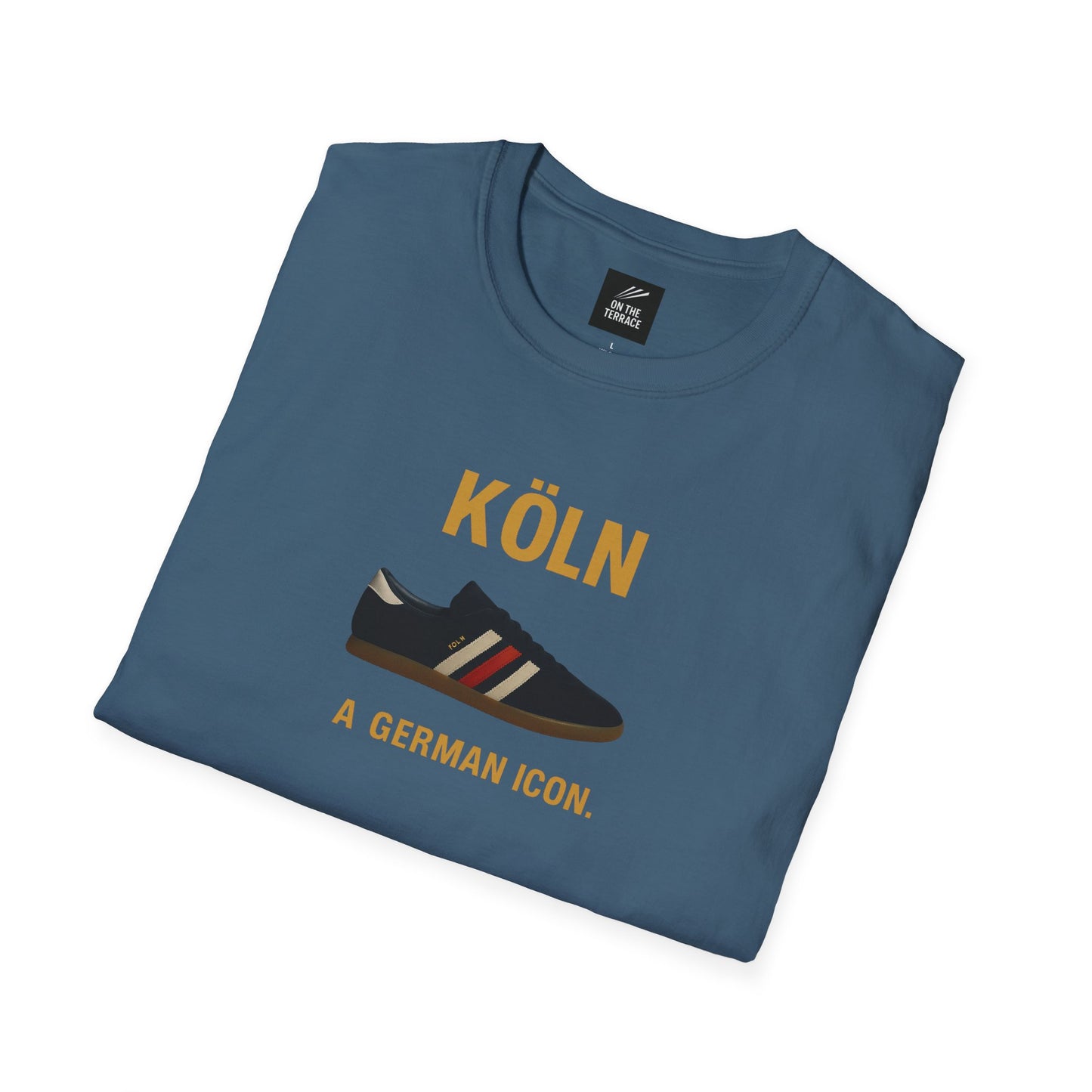 Blue folded t-shirt with graphic of black sneaker and text 'KÖLN A GERMAN ICON.'