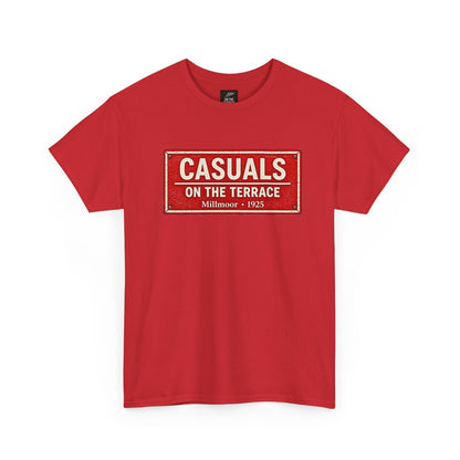 A red short-sleeve Rotherham t-shirt with a vintage-style rectangular graphic on the chest that reads 'CASUALS ON THE TERRACE Millmoor - 1925' in cream and white lettering.