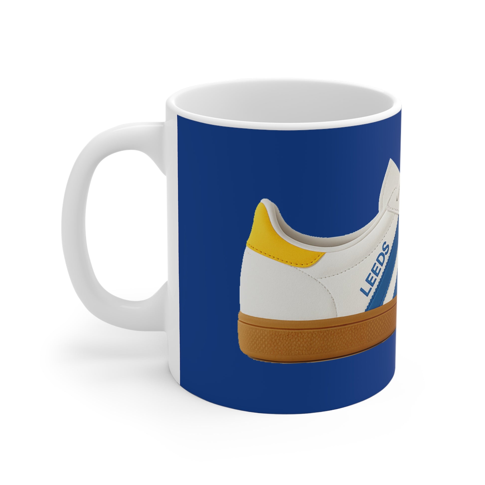 White mug with blue background featuring a white sneaker with yellow heel and "LEEDS" text