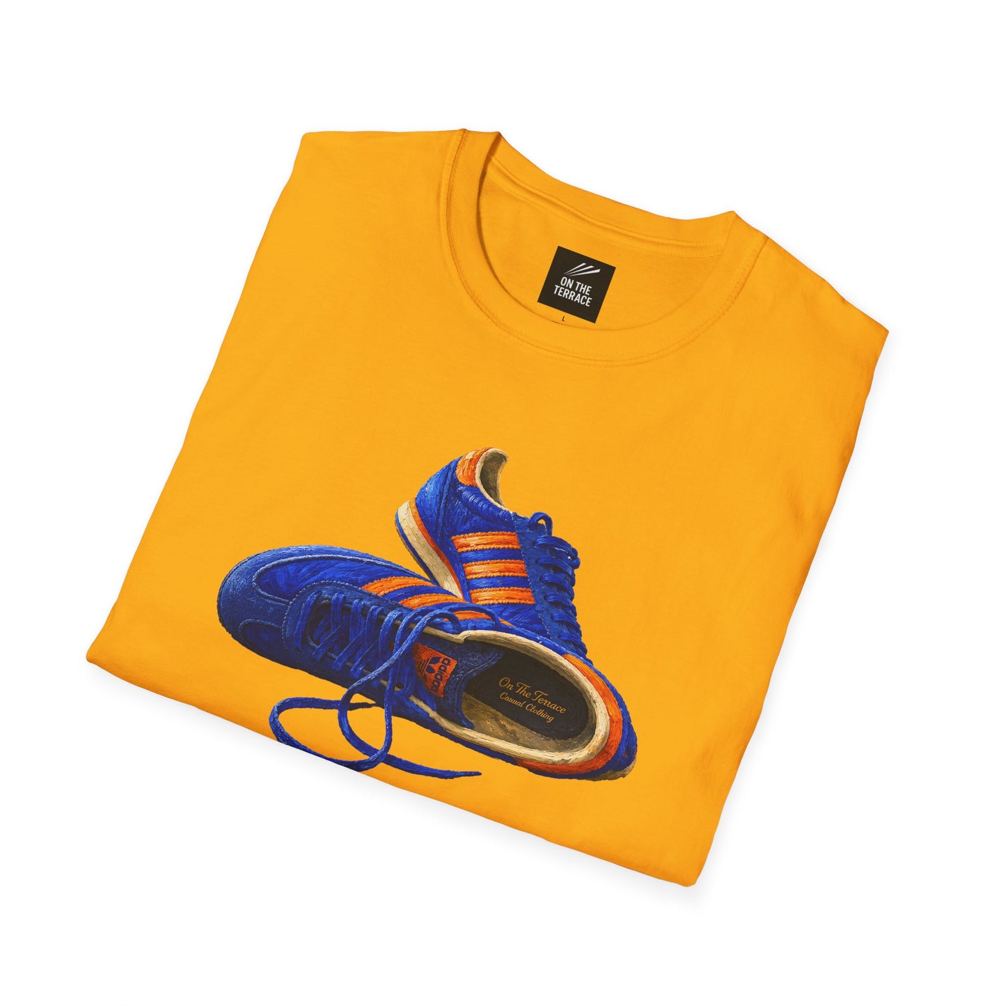A folded Gold t-shirt with hand-illustrated blue and orange retro terrace trainer sneaker graphic print, On The Terrace casual clothing brand
