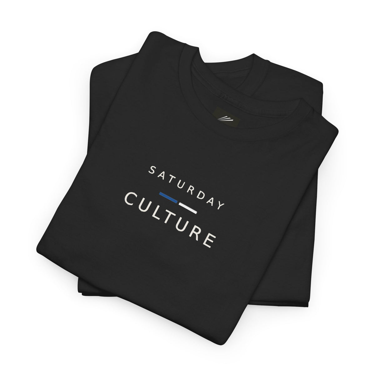 Folded black T-shirt showing Saturday Culture slogan in white