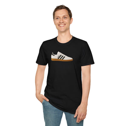 Smiling man wearing black t-shirt with white and black sneaker graphic, paired with blue jeans