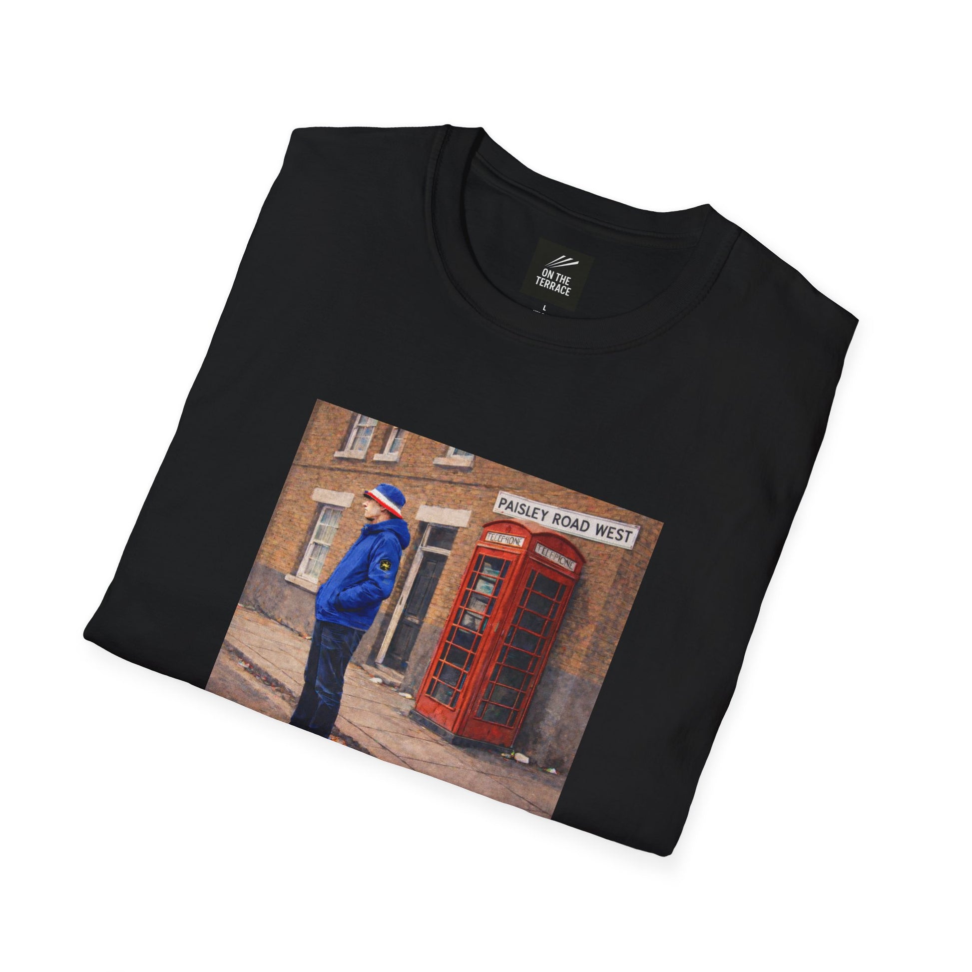 Black t-shirt with a printed design of a person in a blue jacket and red phone box on a white background