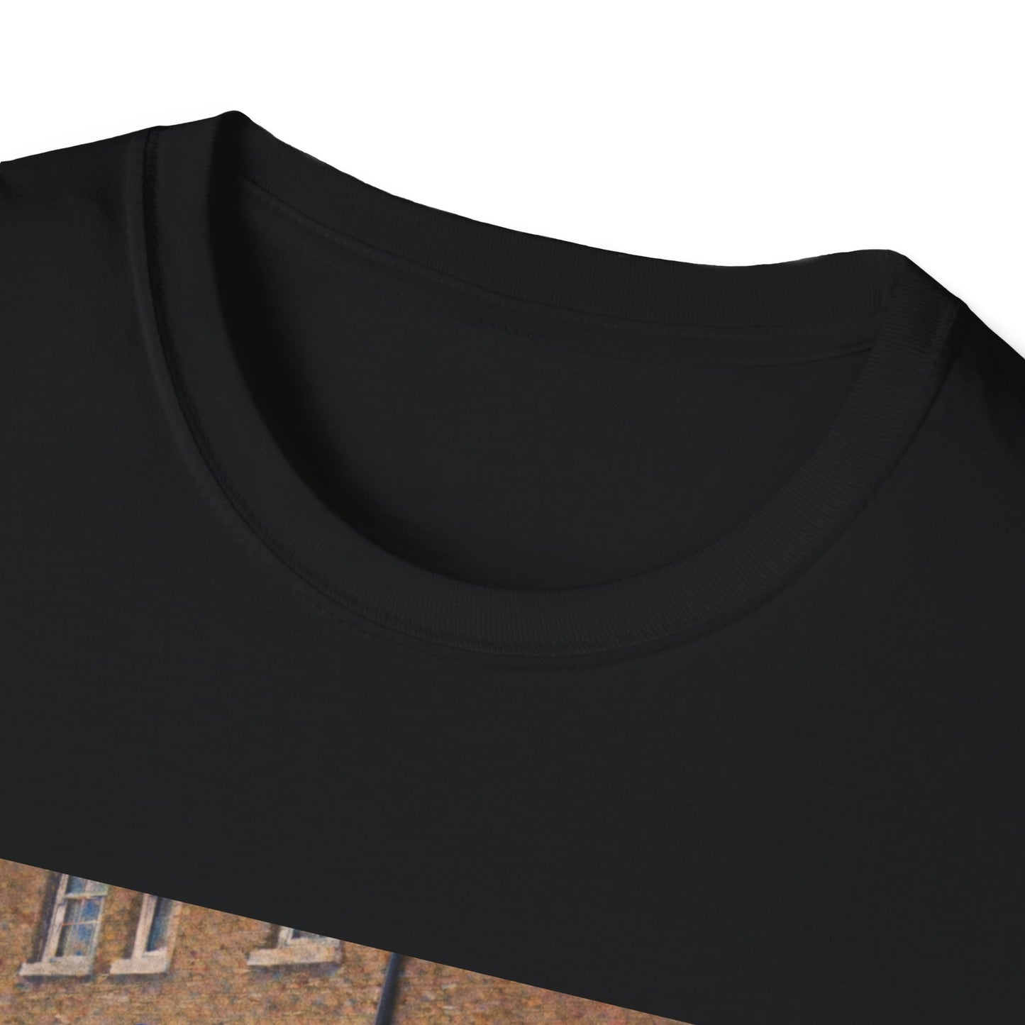 Close-up of a black t-shirt collar with a blurred background