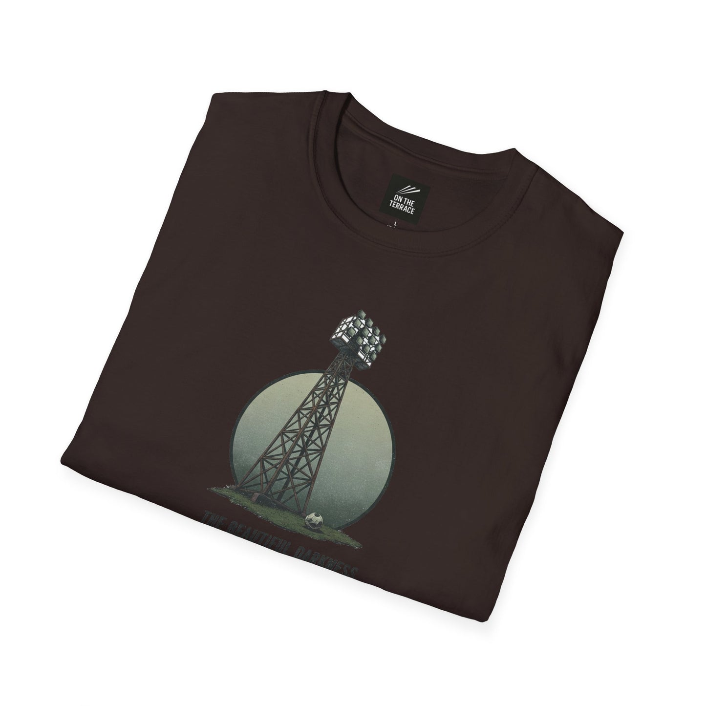 Folded dark brown T-shirt with a stadium floodlight tower and soccer ball graphic