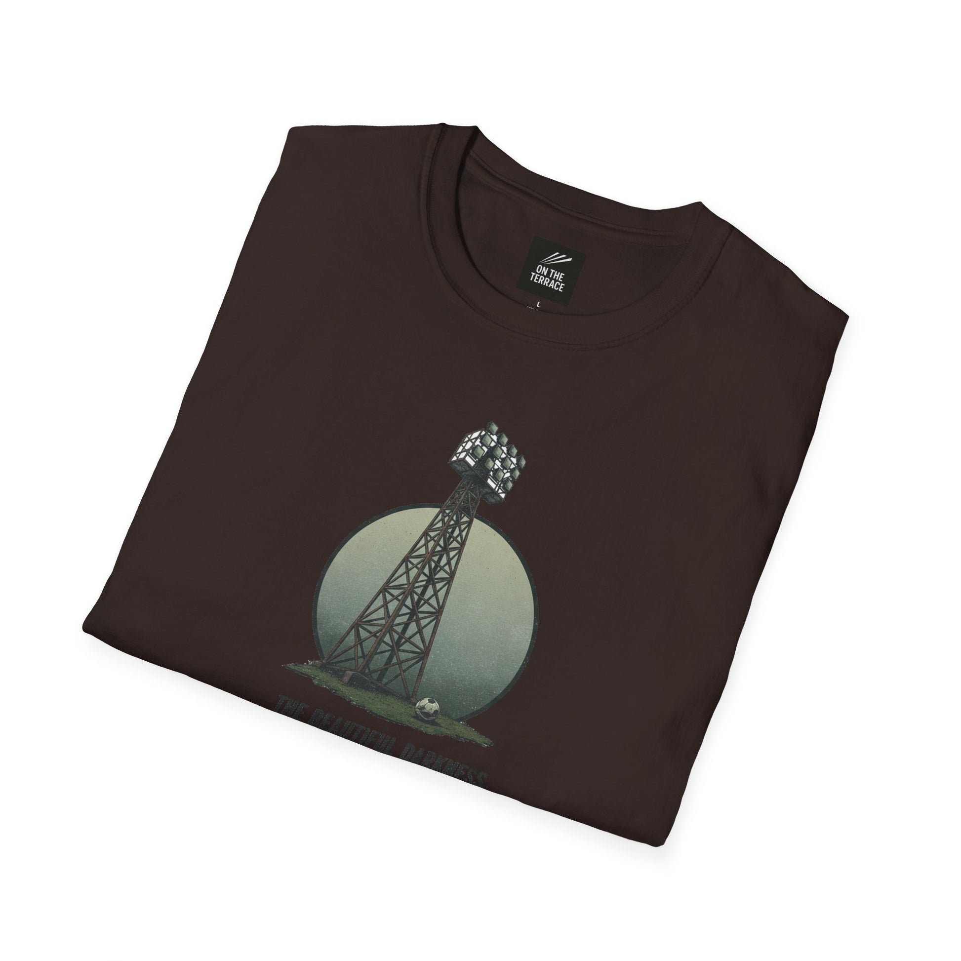 Folded dark brown T-shirt with a stadium floodlight tower and soccer ball graphic