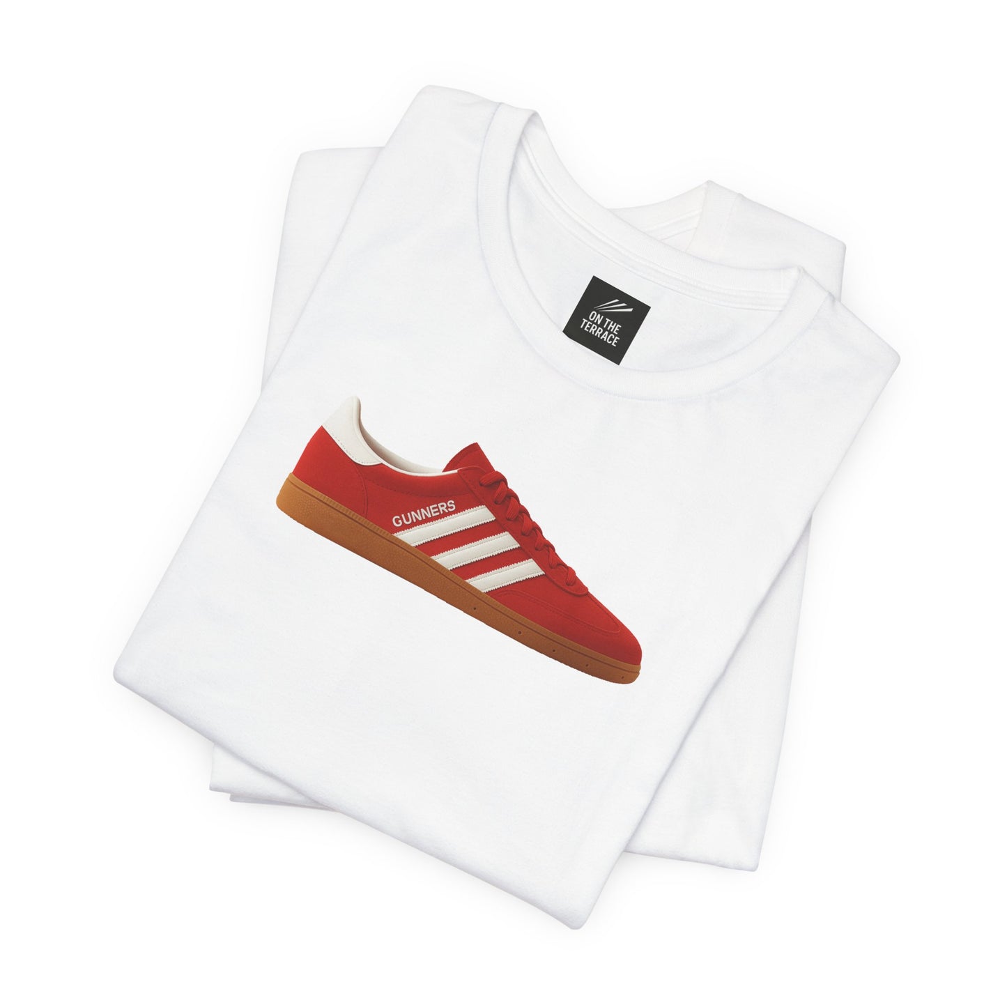 Folded white t-shirt with red sneaker and Gunners text graphic on front