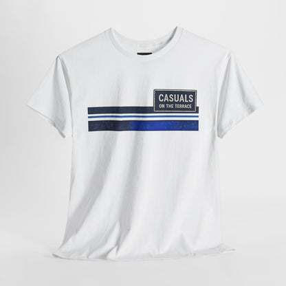 A white short-sleeve crewneck t-shirt with a graphic on the chest featuring a horizontal stripe design in navy blue, white, and dark gray, alongside a dark gray rectangular patch that reads 'CASUALS ON THE TERRACE'.