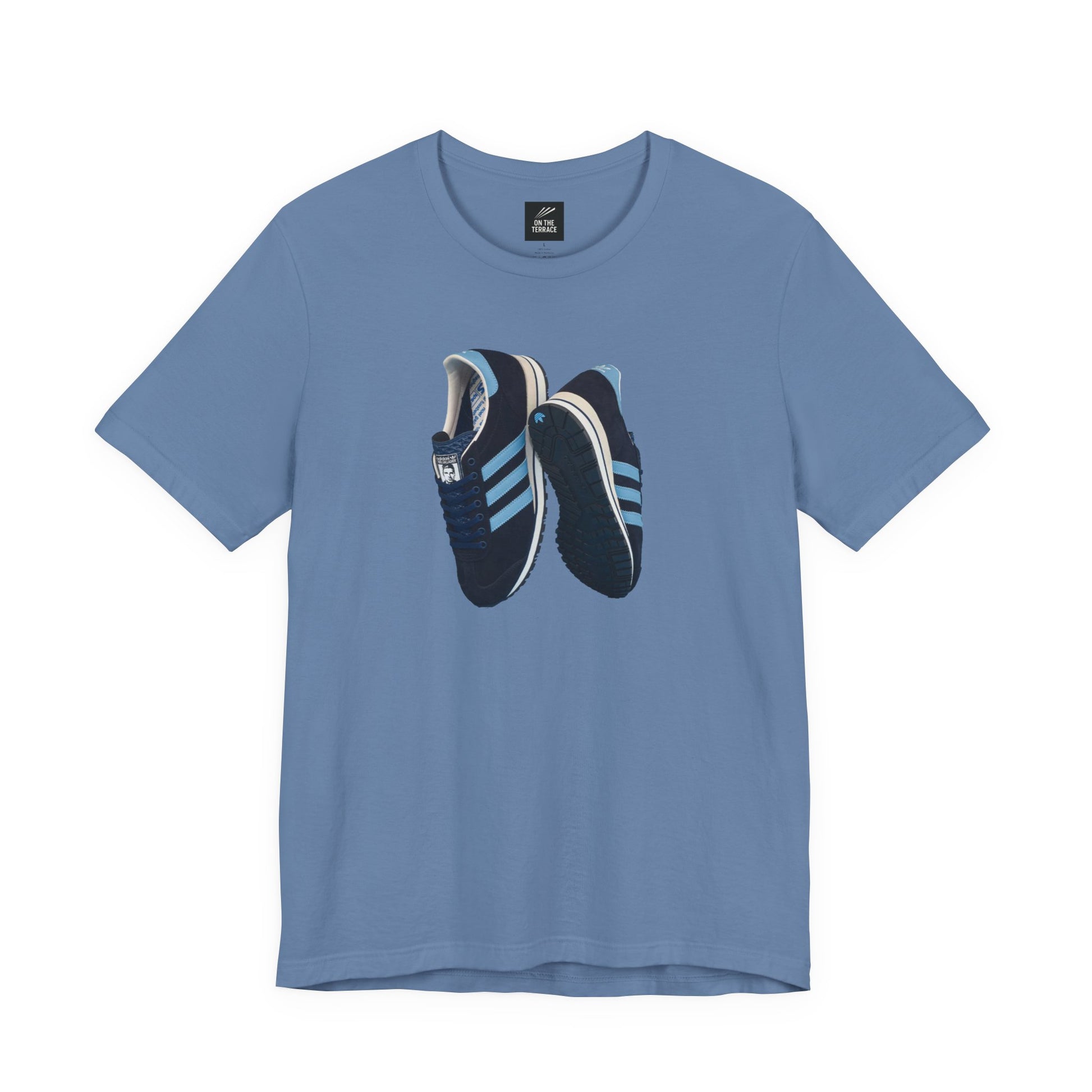 Blue T-shirt with graphic print of blue and black running shoes with light blue stripes