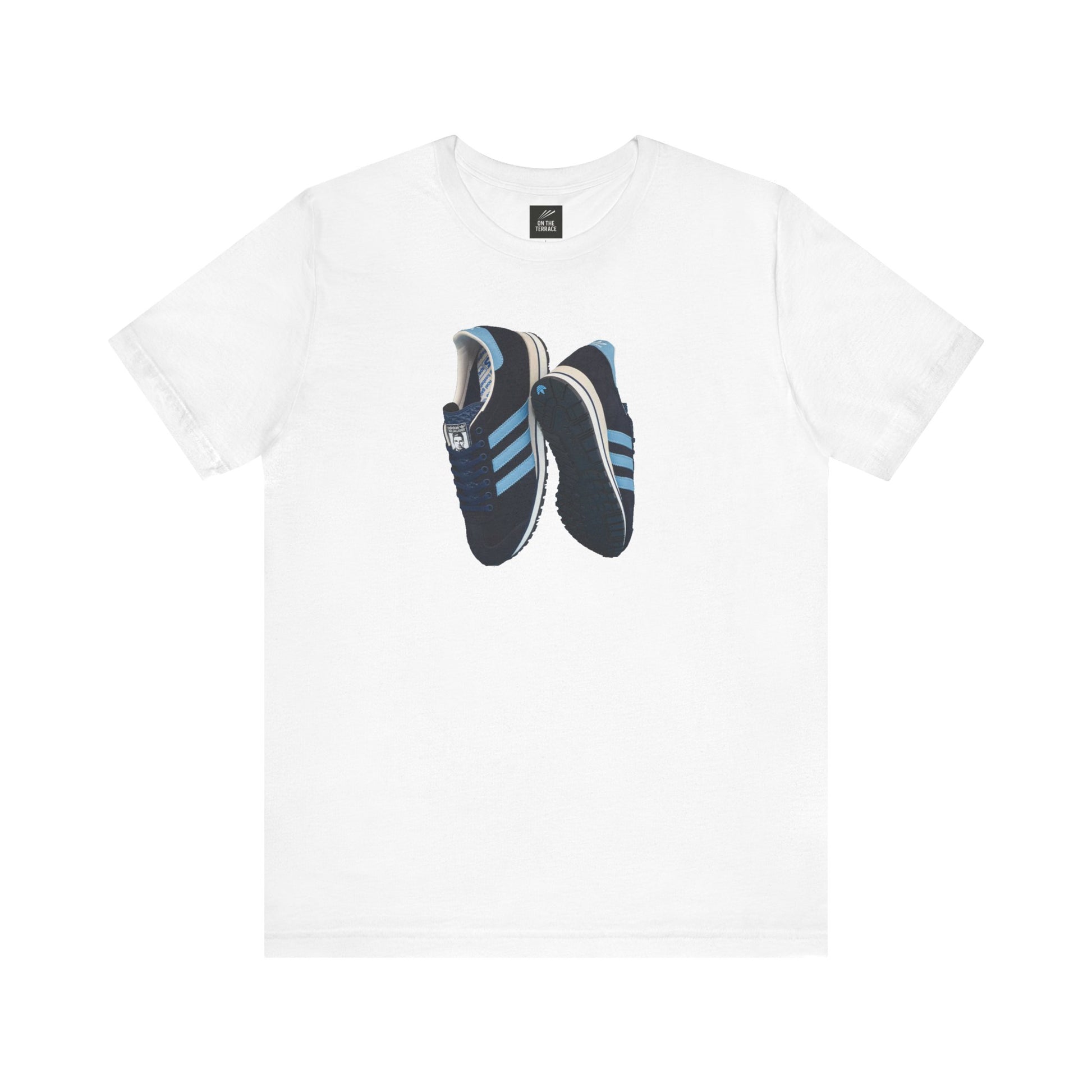 White t-shirt with graphic print of blue and black sneakers featuring light blue stripes