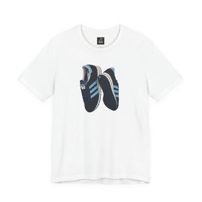 Oasis White t-shirt with a graphic print of blue and black sneakers on the front