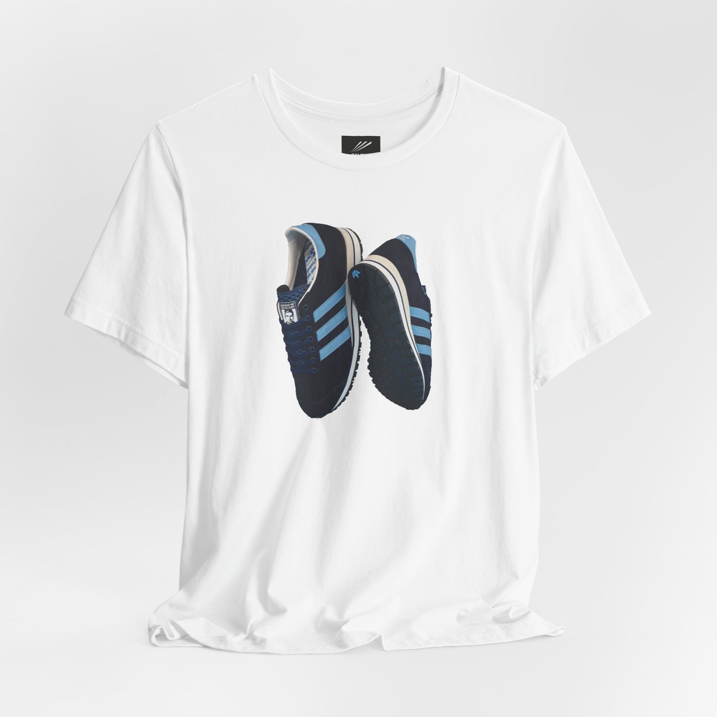 White T-shirt with a print of black and blue Adidas sneakers with blue stripes