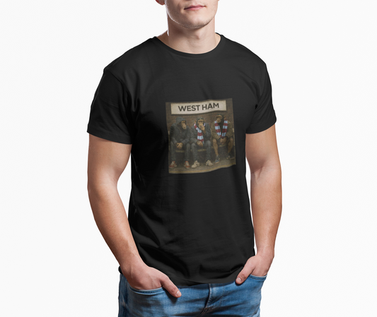 Person wearing a black t-shirt with 'West Ham' graphic design on a white background
