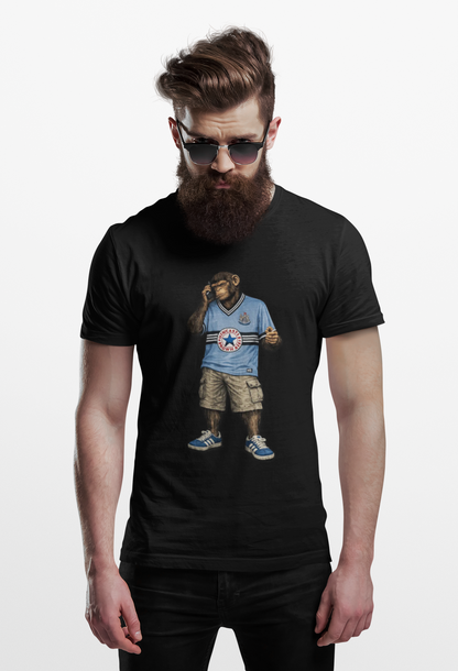 Man wearing a black Newcastle Northern Monkeys t-shirt with a graphic design of a bear in a Newcastle shirt and shorts