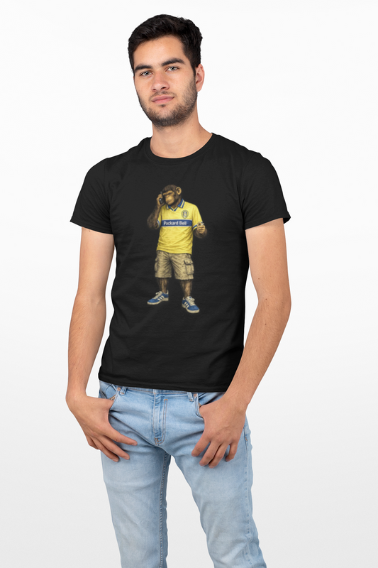 Man wearing a Black Leeds Northern Monkeys t-shirt with a graphic of a bear wearing a yellow Leeds shirt and blue shoes  on a white background