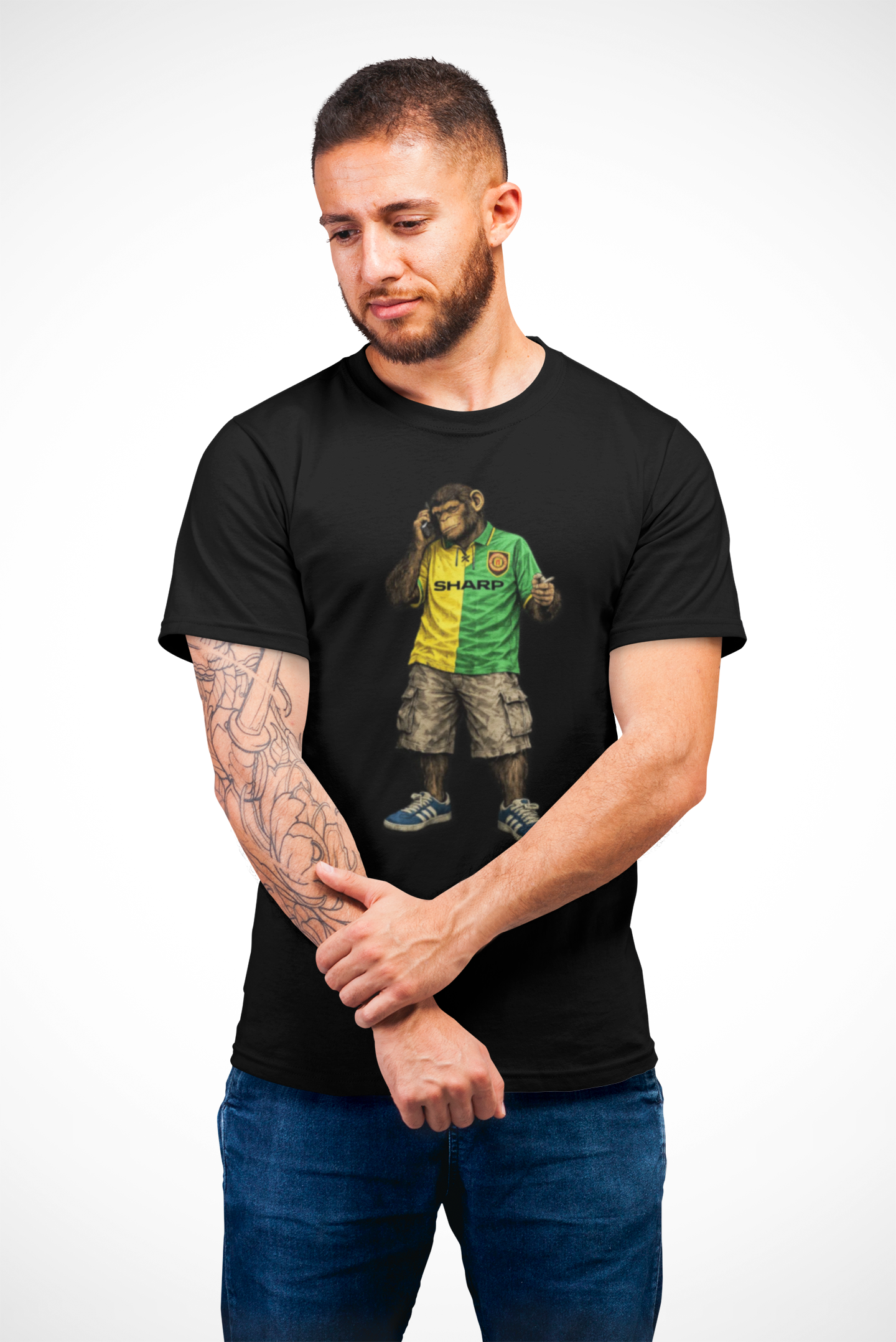 Man wearing a Black Man Utd Northern Monkeys t-shirt with a graphic design on a white background