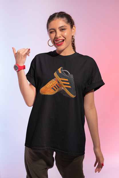 Black t-shirt with orange retro sneaker graphic print showing detailed side and sole view