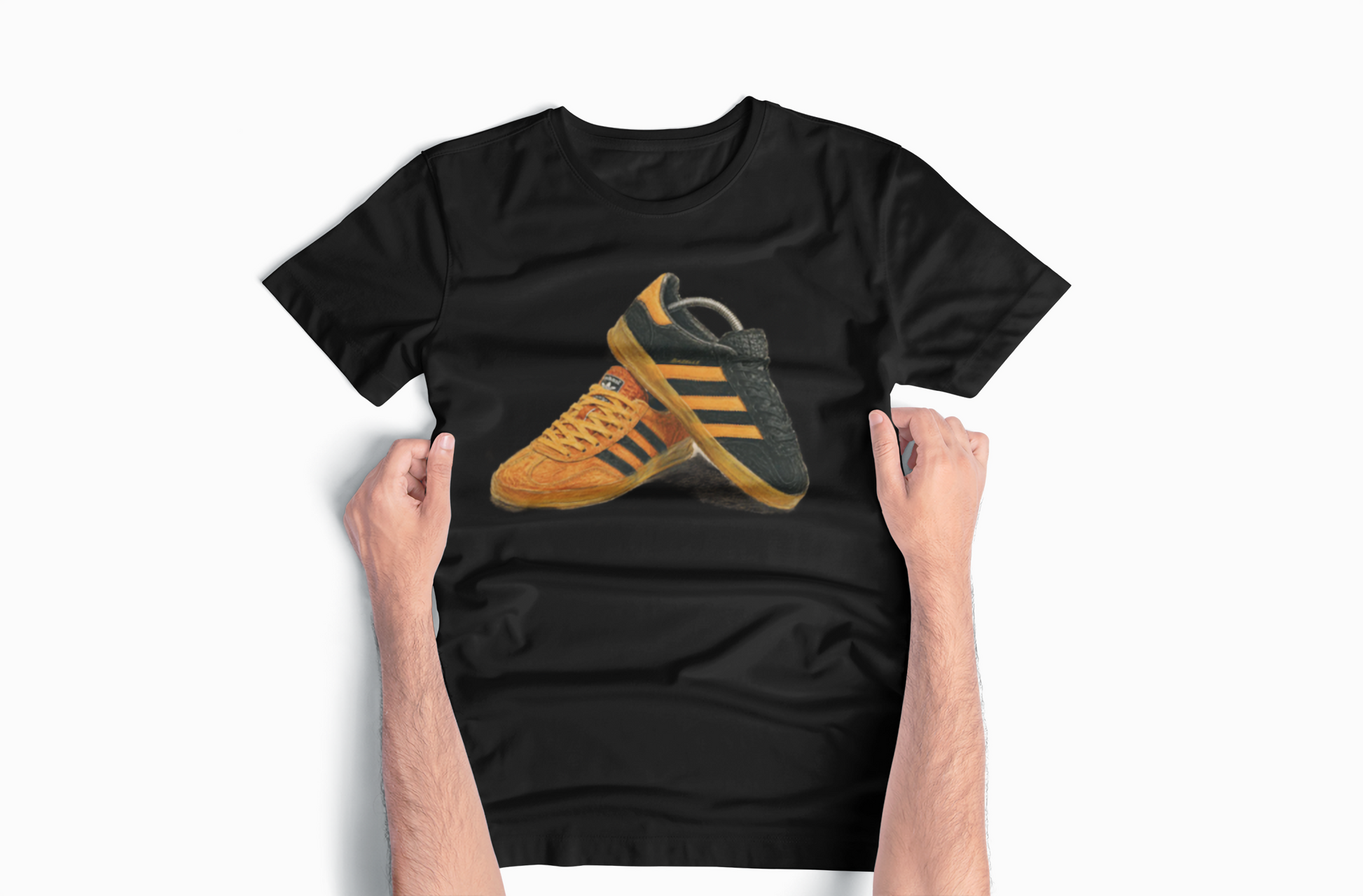 Black t-shirt with orange retro sneaker graphic print showing detailed side and sole view