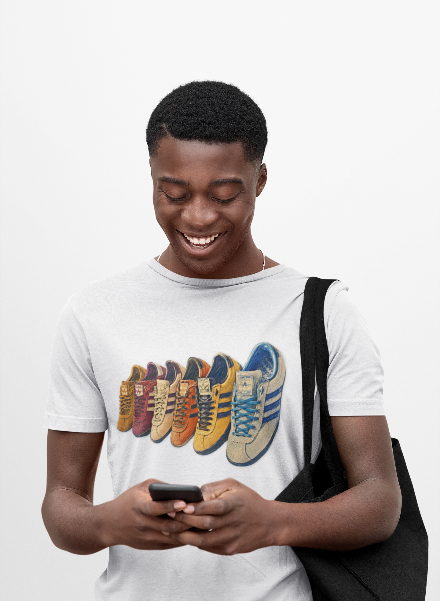 White t-shirt with colorful row of retro sneakers graphic print