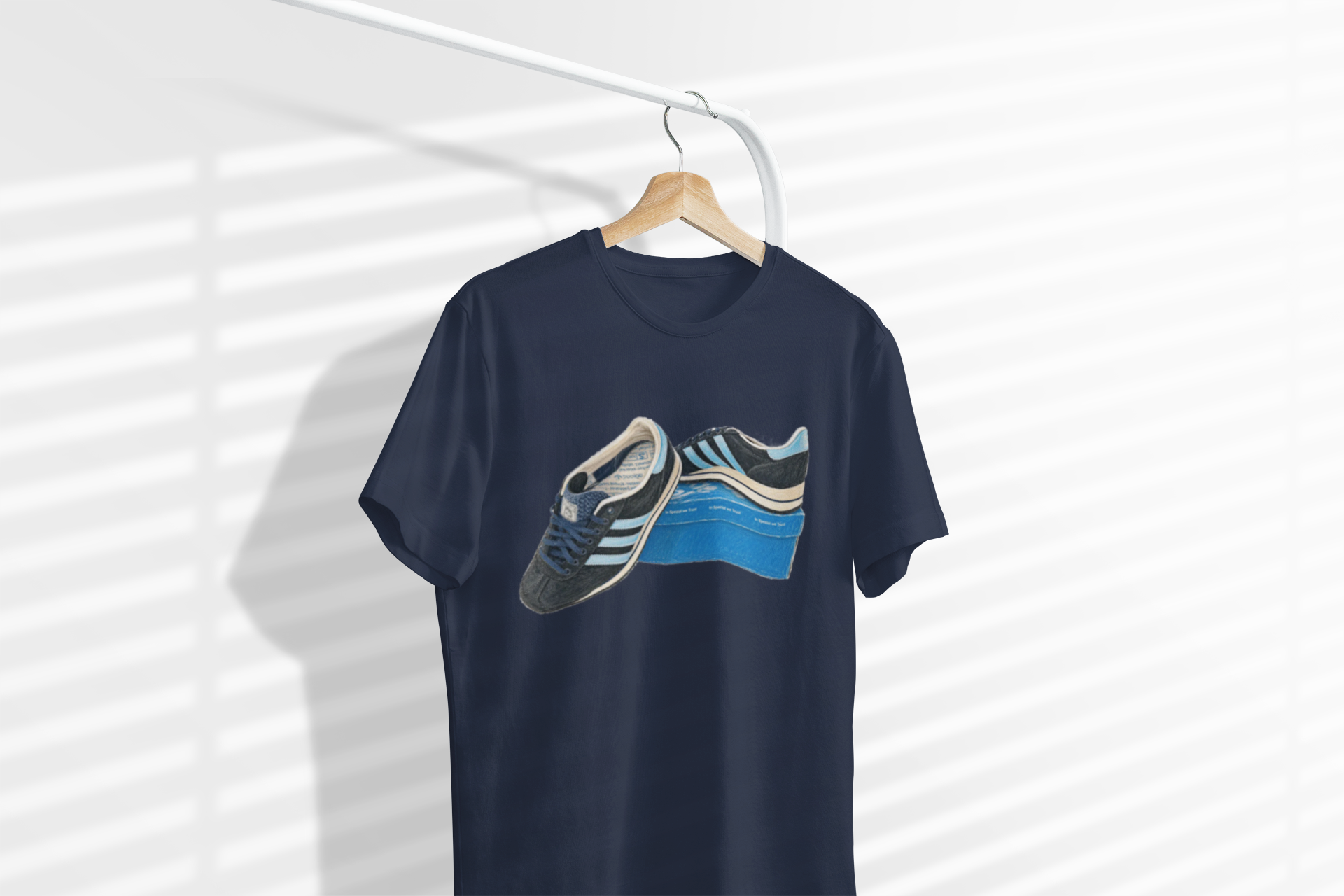 Navy blue retro sneaker graphic t-shirt with vintage trainer and shoebox print