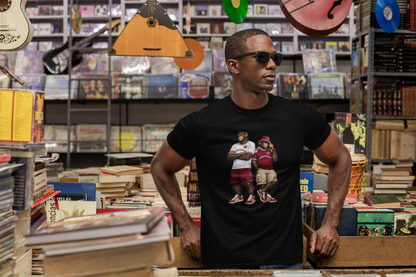 Man wearing a black Hearts t-shirt with 'Motown Detroit' design in a music store.
