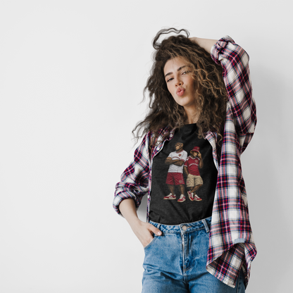A model wearing a black graphic Hearts t-shirt with a vintage-style basketball player print, styled with an open red and white plaid flannel shirt and blue jeans against a plain white background.