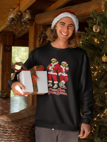 Man in a Santa hat holding a gift, wearing Northern Monkeys Festive Mood Terrace Attitude jumper