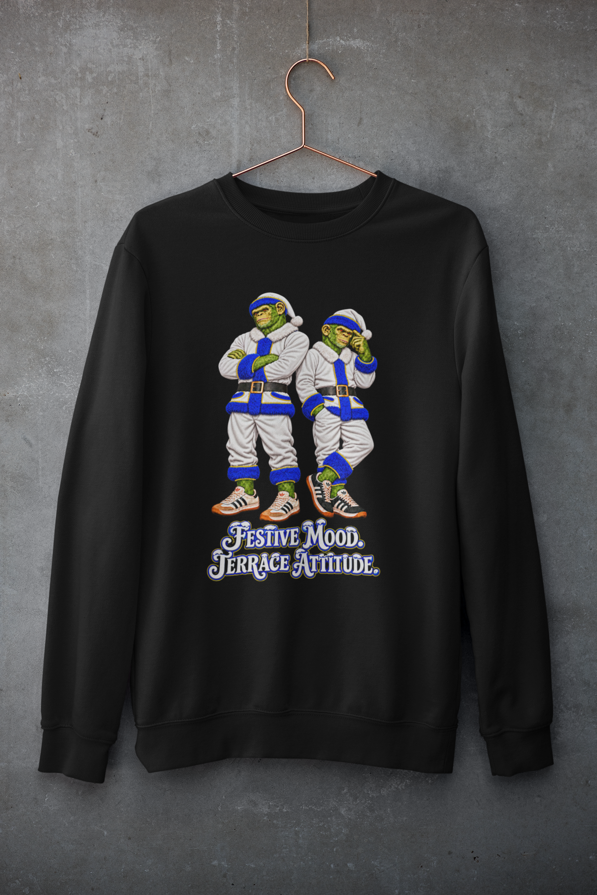 Leeds United white Santa chimps Christmas sweatshirt hanging on a hanger