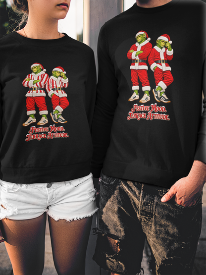 Couple wearing the red and white stripe and classic red Northern Monkeys Christmas jumpers