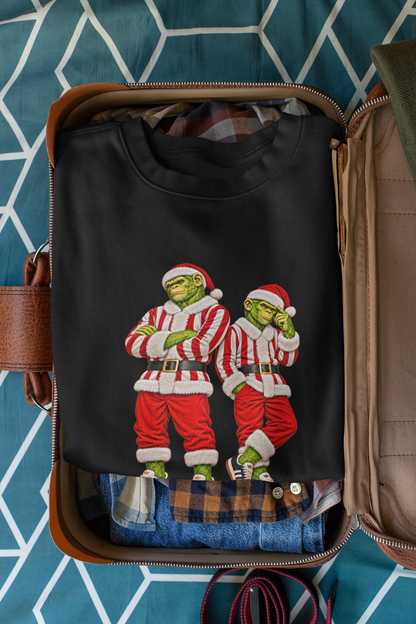 Red and white striped Santa chimps sweatshirt packed in an open suitcase