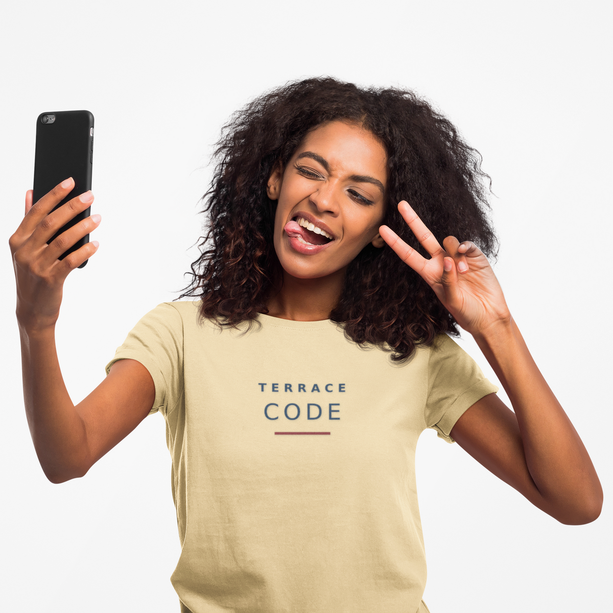 Woman taking a selfie in the pale yellow Terrace Code T-shirt