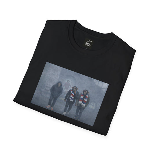 Black Linfield t-shirt with a graphic of four people on a foggy street, folded on a white background.