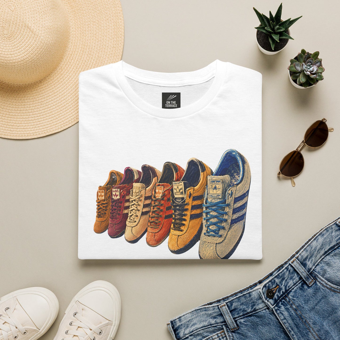 White t-shirt with colorful row of retro sneakers graphic print