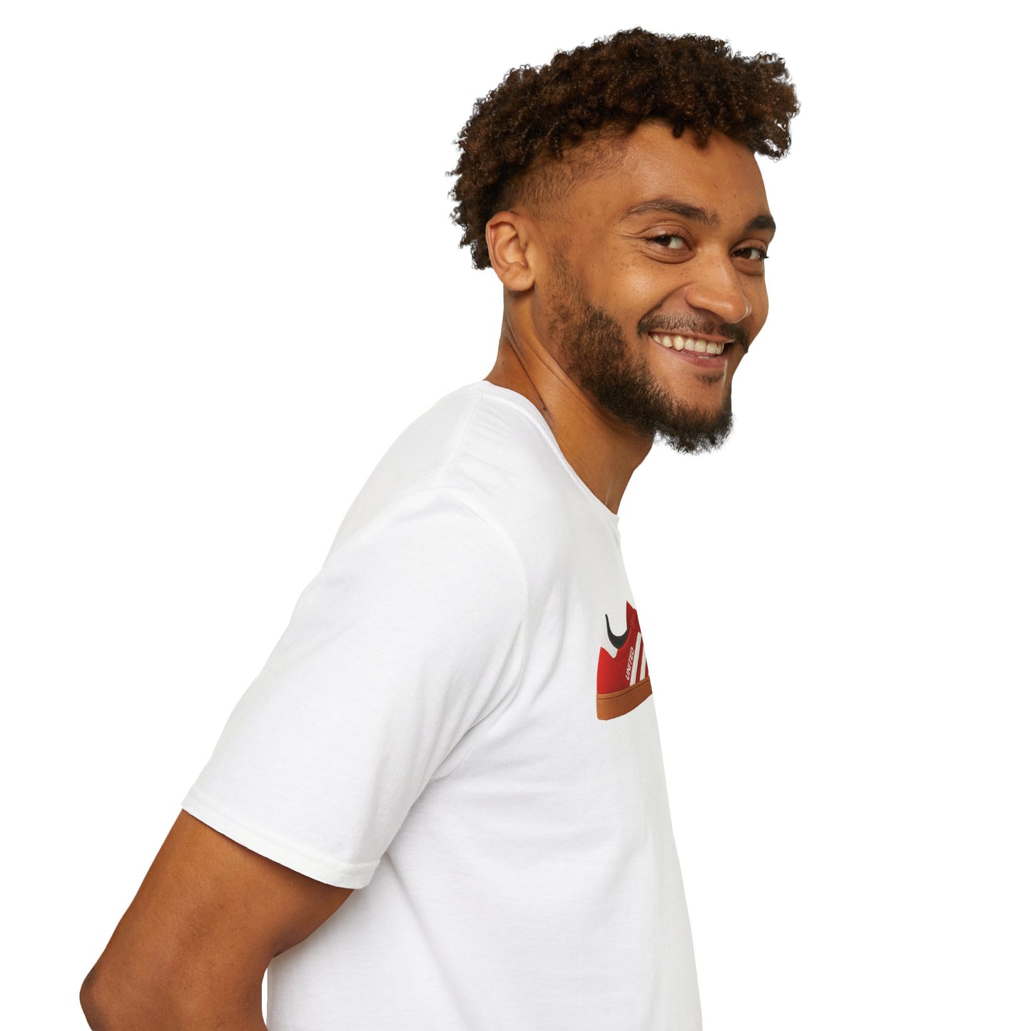 Smiling man with curly hair wearing white T-shirt featuring red sneaker graphic on white background