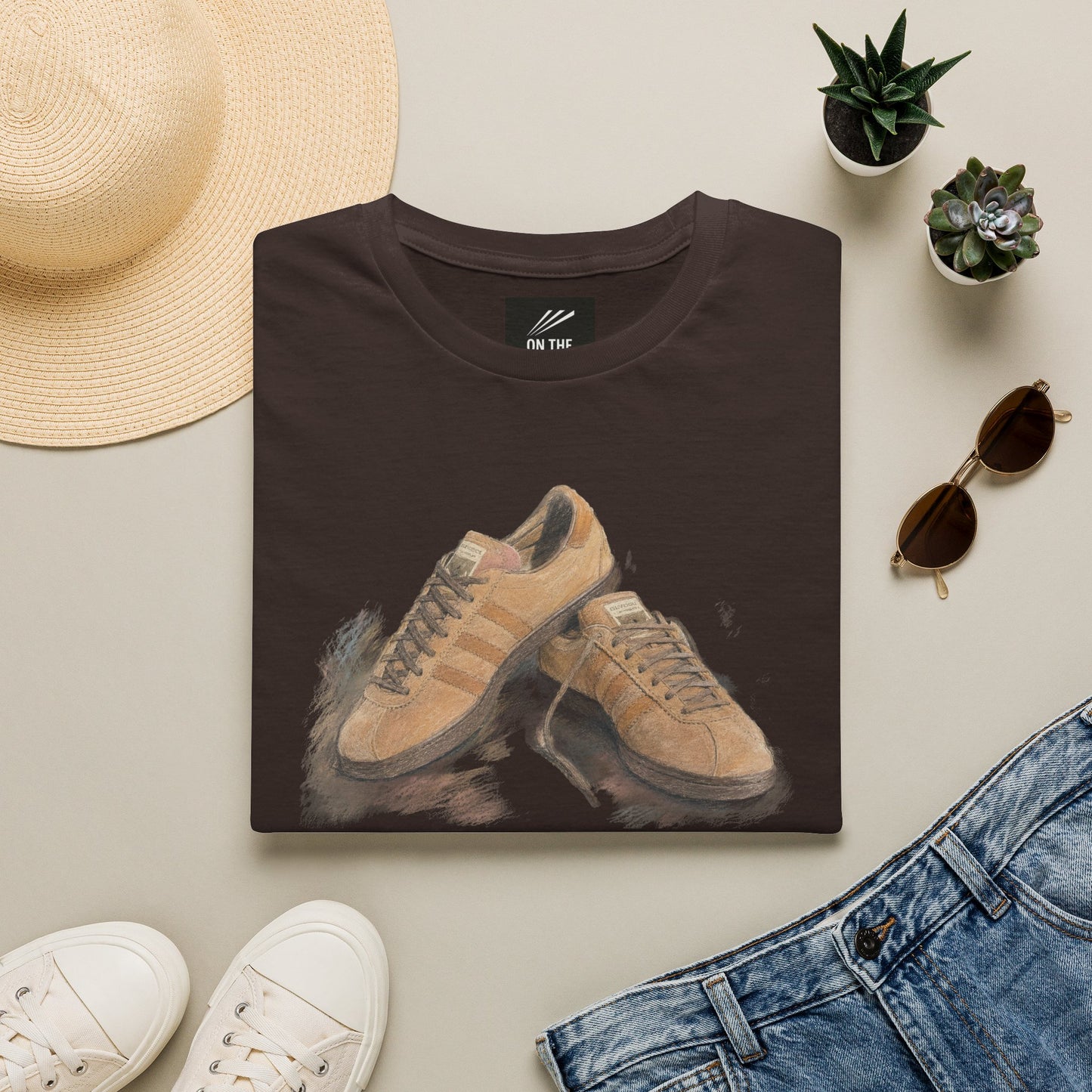 Brown Adidas Samba graphic t-shirt with detailed sneaker print showing side and sole view