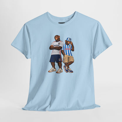 Two chimps in Sky Blues shirts, one with arms folded, one in a striped bucket hat, printed on a sky blue tee