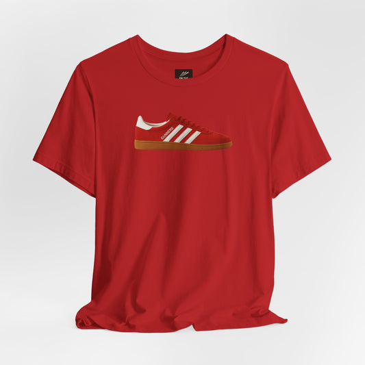 Red t-shirt with a graphic of a red sneaker featuring white stripes and the word GUNNERS