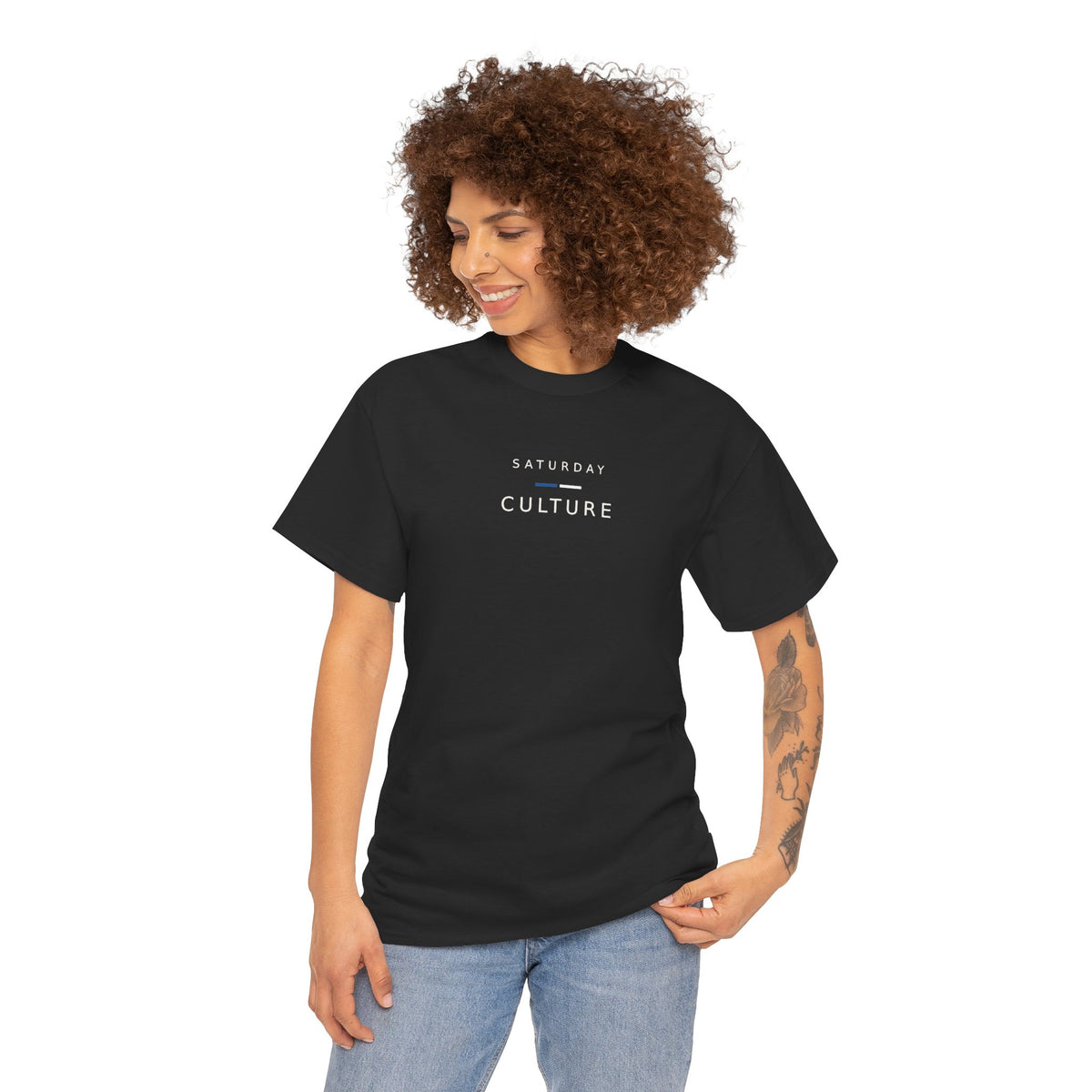 Woman in jeans wearing the black Saturday Culture football casuals tee