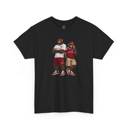 A black short-sleeve Hearts t-shirt featuring a graphic print of two cartoon-style rugby players in sports jerseys, displayed against a solid white background.