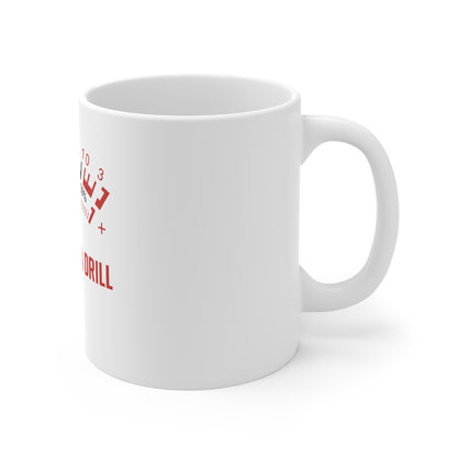 White ceramic coffee mug with red and black text and graphic related to drill speed control