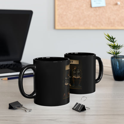 Two black mugs on a desk with a laptop and office supplies in the background.