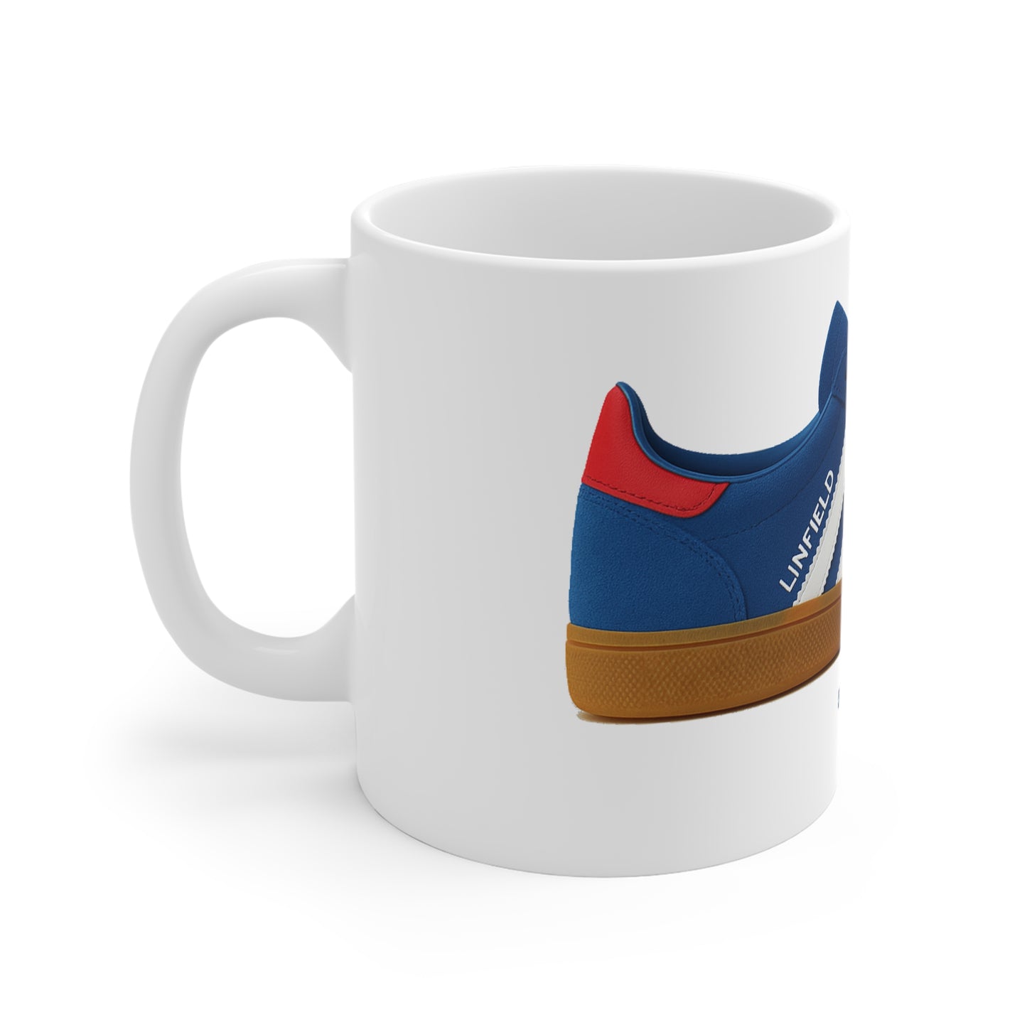 White ceramic coffee mug featuring a blue, red, and gum sole sneaker graphic