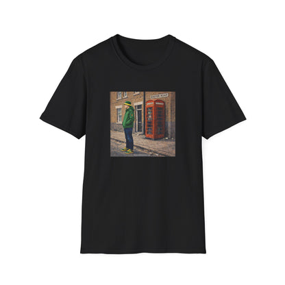 Black t-shirt with a graphic of a person in a green coat standing next to a red telephone box on a white background